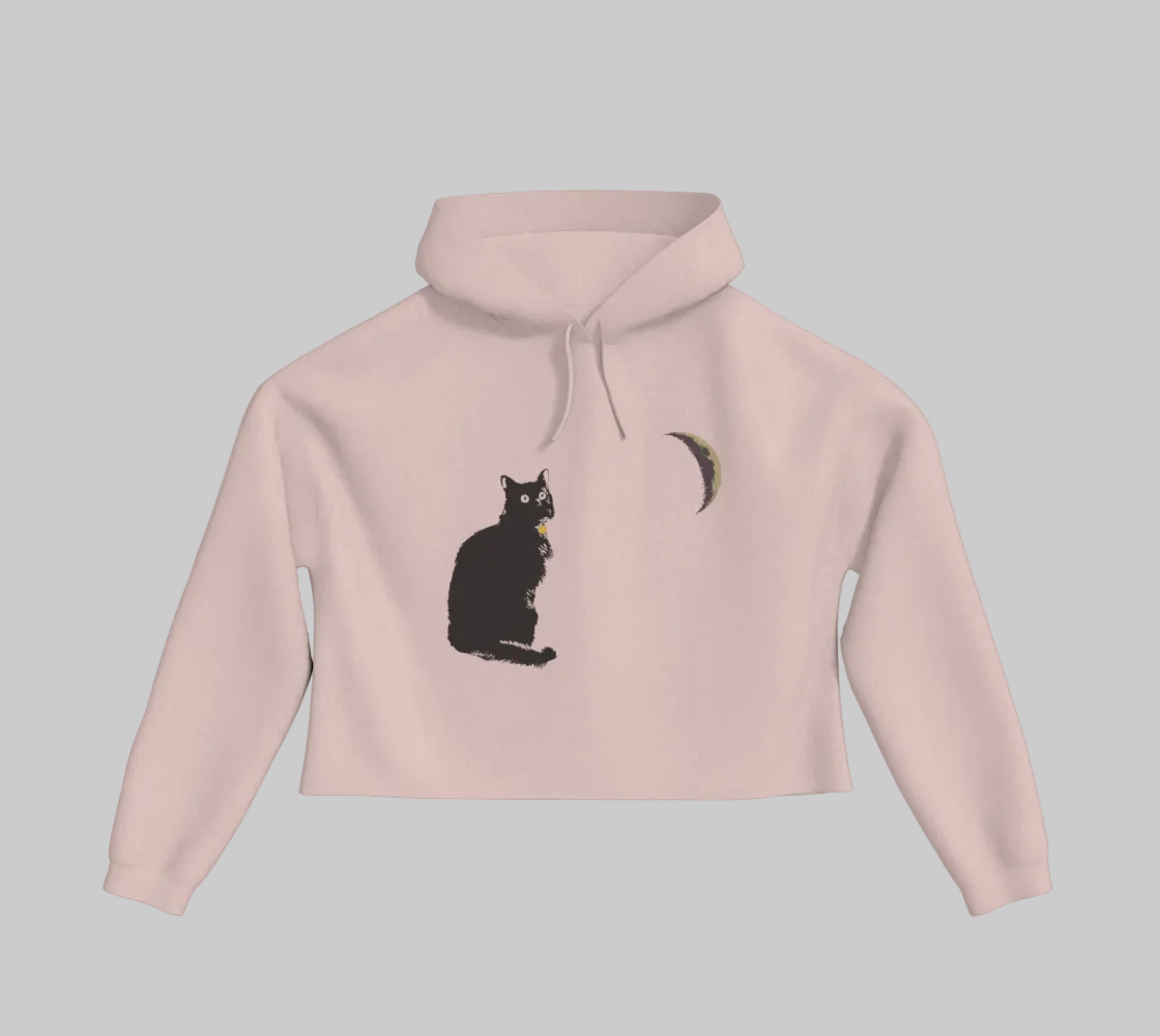 Blush coloured cropped hoodie with a black cat and crescent moon on the front.