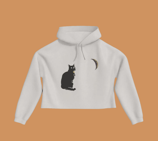 Bone coloured cropped hoodie with a cat and crescent moon on the front.