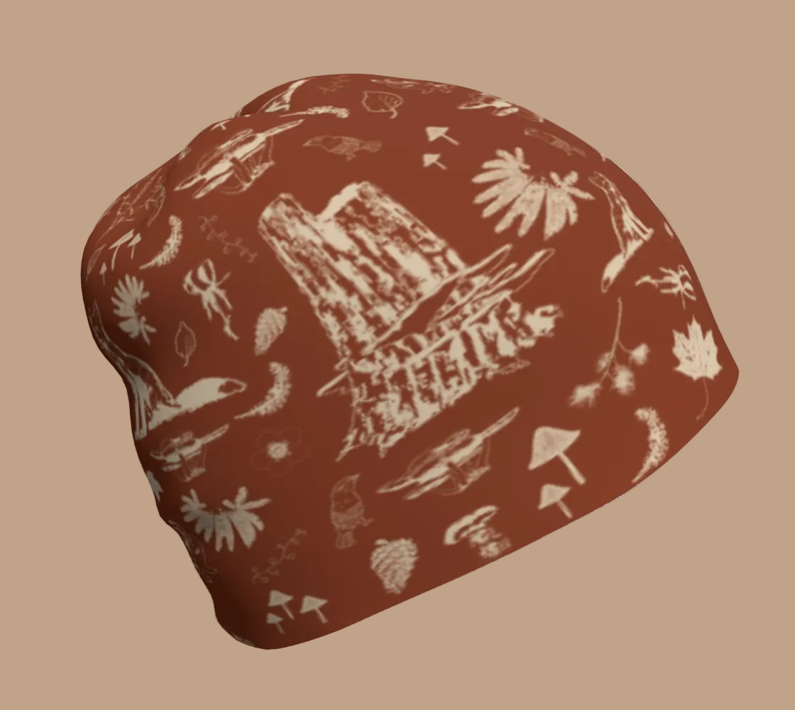 Orange beanie with light coloured forest motifs.
