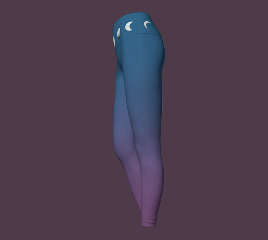 Blue and purple yoga leggings with moon phases motif at waist.